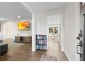 Bright and spacious entryway with hardwood floors and views into the living and dining areas at 4611 Eberline Ct, Stone Mountain, GA 30083