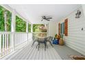 Covered porch with dining set and ceiling fan at 3918 Hardee Nw Dr, Kennesaw, GA 30152