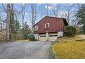 Two car garage with attached driveway and landscaping at 3781 Narmore Ne Dr, Atlanta, GA 30319