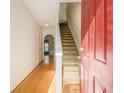 Bright entryway with hardwood floors and staircase at 566 Maggie Ln, Jonesboro, GA 30238