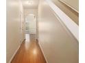 Hardwood floor hallway with doors to rooms at 566 Maggie Ln, Jonesboro, GA 30238