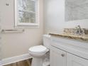 Updated bathroom with granite countertop, white vanity, and tile shower at 748 Amber Nw, Atlanta, GA 30331