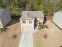 Two-story house with gray roof, a two-car garage, and landscaping at 1752 Alford Dr, Jonesboro, GA 30236