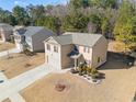 Two-story house with gray roof, two-car garage, and manicured lawn at 1752 Alford Dr, Jonesboro, GA 30236