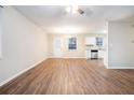 Spacious living room with hardwood floors and an open kitchen at 3355 Renault Se Rd, Atlanta, GA 30354
