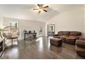 Spacious living room featuring hardwood floors, a vaulted ceiling, and ample natural light at 675 Mayes Rd, Powder Springs, GA 30127