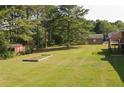 Large backyard with shed and garden area at 1308 Crumbley Rd, Mcdonough, GA 30252