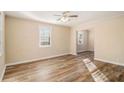 Bright living room with wood-look floors and ceiling fan at 1903 Wildwood Dr, Decatur, GA 30032