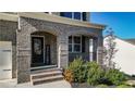 Brick front porch with arched entryway and a welcome sign at 505 Blue Mountain Rise, Canton, GA 30114