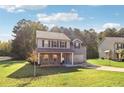 Two-story house with stone accents and a two-car garage at 401 Camella Cir, Mcdonough, GA 30252