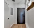 Simple entryway with dark gray door and wood-look flooring at 260 18Th Nw St # 10203, Atlanta, GA 30363