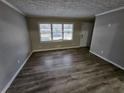 Bright living room featuring hardwood floors and large windows at 3445 Mell Pl, Clarkston, GA 30021