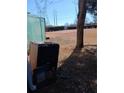 Large backyard with a compost bin and shed at 2479 Kingsland Dr, Dunwoody, GA 30360