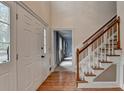 Two-story entryway with hardwood floors and staircase at 947 Pinbrook Dr, Lawrenceville, GA 30043