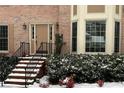 Brick front entrance with steps leading to a double door at 947 Pinbrook Dr, Lawrenceville, GA 30043
