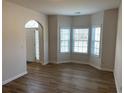 Bright living room with bay windows and hardwood floors at 1238 Polk Xing, Mcdonough, GA 30252