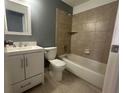 Updated bathroom with a white vanity and tiled shower/tub at 4626 Midridge Dr, Norcross, GA 30093