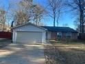 House exterior showcasing a beige garage and brick facade at 4626 Midridge Dr, Norcross, GA 30093