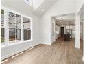 Bright dining room with hardwood floors and views of the kitchen at 507 Pearl St, Cumming, GA 30040