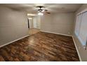 Living room featuring hardwood floors and neutral walls at 385 Shannon Way, Lawrenceville, GA 30044