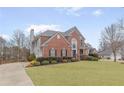 Brick house with a long driveway and mature trees at 9706 Spyglass Dr, Villa Rica, GA 30180