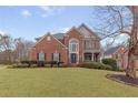 Brick two-story house with a large front yard at 9706 Spyglass Dr, Villa Rica, GA 30180