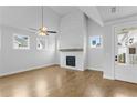Bright living room with hardwood floors, fireplace, and high ceilings at 515 Pearl St, Cumming, GA 30040