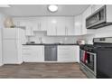Modern kitchen with white cabinets and stainless steel appliances at 346 Carpenter Dr # 51, Atlanta, GA 30328