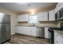 Updated kitchen with stainless steel appliances at 3211 Sandusky Dr, Decatur, GA 30032