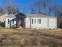 Newly renovated 1-story home with gray siding and a welcoming front porch at 1336 Diamond Se Ave, Atlanta, GA 30316