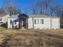 Newly renovated 1-story home with gray siding and a welcoming front porch at 1336 Diamond Se Ave, Atlanta, GA 30316