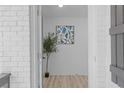 Bright entryway with hardwood floors and modern art at 2233 Troutdale Dr, Decatur, GA 30032