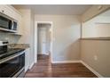 Eat-in kitchen with breakfast bar and access to hallway at 4424 Malibu Dr, Decatur, GA 30035