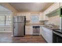 Updated kitchen with stainless steel appliances and granite countertops at 4424 Malibu Dr, Decatur, GA 30035