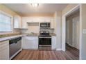 Modern kitchen featuring granite countertops and stainless steel appliances at 4424 Malibu Dr, Decatur, GA 30035