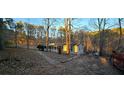 House exterior with driveway and car at 710 Seals Rd, Dallas, GA 30157
