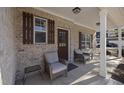 Inviting front porch with two wicker chairs at 860 N Bethany Rd, Mcdonough, GA 30252