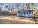 View of a cute home featuring light blue siding, white trim, and well-maintained landscaping at 2183 Pansy Nw St, Atlanta, GA 30314