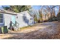 The backyard features light blue siding and a quaint back entrance, ideal for outdoor access at 2183 Pansy Nw St, Atlanta, GA 30314