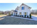 House exterior showcasing a landscaped yard and walkway at 5470 Crow Dr, Cumming, GA 30041