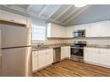Modern kitchen with granite countertops and stainless steel appliances at 6695 Buckhurst Trl, Atlanta, GA 30349