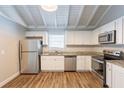 Modern kitchen with granite countertops and stainless steel appliances at 6695 Buckhurst Trl, Atlanta, GA 30349