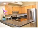 Modern kitchen featuring stainless steel appliances and wood cabinets at 32 Peachtree St # 403, Atlanta, GA 30303