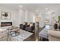 Open living room with hardwood floors and a modern fireplace at 456 Parkway Ne Dr # 12, Atlanta, GA 30308
