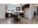 Modern kitchen with dark cabinetry, island, and stainless steel appliances at 960 Bibbs Nw Cir # 2, Atlanta, GA 30318