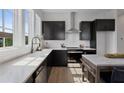Modern kitchen with dark cabinetry and quartz countertops at 960 Bibbs Nw Cir # 2, Atlanta, GA 30318