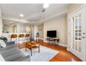 Open living room with hardwood floors and access to kitchen and balcony at 230 E Ponce De Leon Ave # 317, Decatur, GA 30030