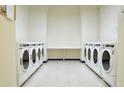 Convenient laundry room with multiple washers and dryers at 20 Marietta Nw St # 6F, Atlanta, GA 30303
