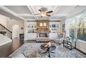 Cozy living room featuring a stone fireplace, built-in shelves, and comfortable seating at 9475 Dunmoore Dr, Cumming, GA 30028