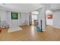 Living room with hardwood floors and neutral walls at 220 Baltimore Ave, Stockbridge, GA 30281